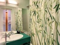 a bathroom with a sink and a shower curtain at Studio Le Corbier, 1 pièce, 5 personnes - FR-1-267-232 in Villarembert