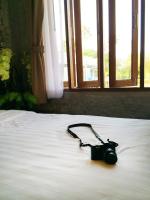 Postel nebo postele na pokoji v ubytování Laemsing Whitehouse Resort