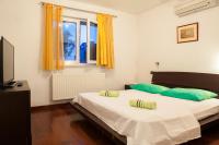 Posteľ alebo postele v izbe v ubytovaní Apartments Tino