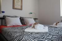 Łóżko lub łóżka w pokoju w obiekcie Apartments PineWood Villa