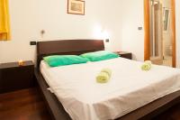 Posteľ alebo postele v izbe v ubytovaní Apartments Tino