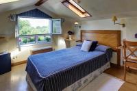 Postel nebo postele na pokoji v ubytování Hotel Mirador del Sella