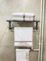 a towel rack with towels on it in a bathroom at Chez les deux garçons in Montrouge