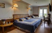 Postel nebo postele na pokoji v ubytování Hotel Mirador del Sella