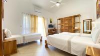 Postel nebo postele na pokoji v ubytování Albachiara Hotel - Las Terrenas