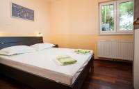Posteľ alebo postele v izbe v ubytovaní Apartments Tino