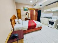 Kuchyň nebo kuchyňský kout v ubytování Al Ghadeer Hotel Apartment