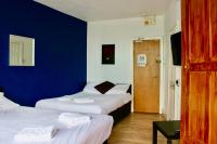 Henson Hotel Pleasure Beachにあるベッド