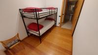 A bed or beds in a room at Appartamento Alessandro
