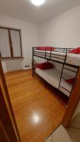 A bed or beds in a room at Appartamento Alessandro
