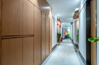 a corridor of an office building with wooden walls at WAIFIDEN Hotel -Former Tokai Hotel in Guangzhou