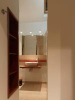 a bathroom with a sink and a mirror at L’Arabesque, villa de charme avec piscine in Arradon