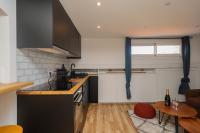 a kitchen with a counter top and a table at Villa Corbelle - Grand Studio in Cannes