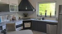 Kuchyňa alebo kuchynka v ubytovaní Apartman GRIZZLY