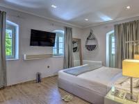 Fiscardonna Luxury Suitesにあるベッド