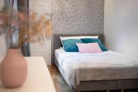 Posteľ alebo postele v izbe v ubytovaní AtHome Toruń Apartamenty
