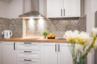 Kuchyňa alebo kuchynka v ubytovaní AtHome Toruń Apartamenty