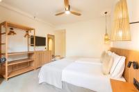 Postel nebo postele na pokoji v ubytování Playa Surf CBbC Hotel