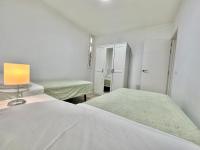 A bed or beds in a room at Juan XXIII