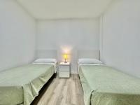 A bed or beds in a room at Juan XXIII