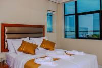 a bedroom with a bed with towels on it at Bora Hotel in Iquitos