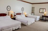 Rúm í herbergi á Nobile Suites Excelsior Asuncion