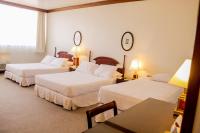 Rúm í herbergi á Nobile Suites Excelsior Asuncion