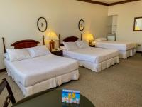 Rúm í herbergi á Nobile Suites Excelsior Asuncion