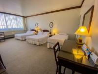 Rúm í herbergi á Nobile Suites Excelsior Asuncion