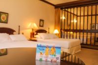Rúm í herbergi á Nobile Suites Excelsior Asuncion