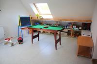 a room with a ping pong table in a room at Maison Mélèry in Saint-Pierre-du-Val