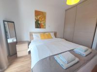 Postel nebo postele na pokoji v ubytování Palm Beach Apartment 26