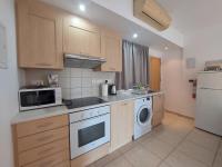 Kuchyň nebo kuchyňský kout v ubytování Palm Beach Apartment 26