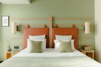 Posteľ alebo postele v izbe v ubytovaní Hôtel Parc du Landreau