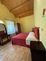 A bed or beds in a room at Taverna dei Guelfi