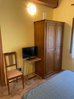 A television and/or entertainment centre at Taverna dei Guelfi