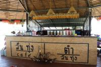 a counter with a sign on it in a room at Whitehouse resort in Ban Muang Chum