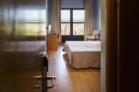 A bed or beds in a room at AS Monreal del Campo
