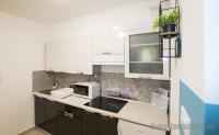Kuchyňa alebo kuchynka v ubytovaní Tisza Gyöngye Apartmanok