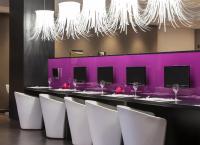 A television and/or entertainment centre at Ilunion Bel-Art