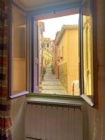 an open window with a view of a street at À deux pas de la plage in Collioure