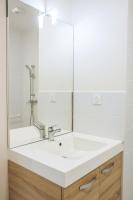 a bathroom with a white sink and a mirror at Twenty Business Flats Béziers in Béziers