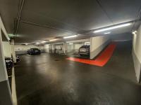 a parking garage with two cars parked in it at Holiday Inn Vienna City by IHG in Vienna