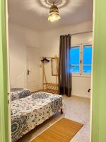 Postel nebo postele na pokoji v ubytování Appartement Vue de Mer Pied dans l'eau