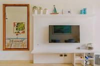 TV a/nebo společenská místnost v ubytování Cana Rock 108 Acceso Directo Piscina Punta Cana