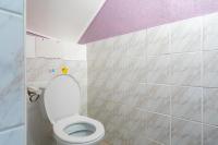 a bathroom with a white toilet with a purple ceiling at Maison des Charmettes in Nîmes