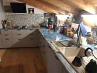 a kitchen with a sink and a counter top at Chez Pierrette et Eugène Prix nuitée&#47;10 personne in Le Lautaret