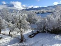 a view of a snow covered forest with trees at Chez Pierrette et Eugène Prix nuitée&#47;10 personne in Le Lautaret