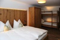 A bed or beds in a room at Apartment in Bramberg am Wildkogel with barbecue