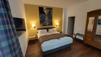 Postel nebo postele na pokoji v ubytování Hotel & Café KleinerGrünauer